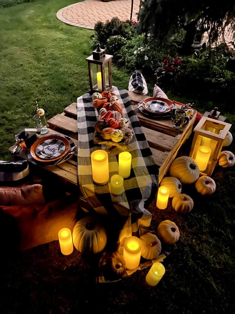 Outdoor fall tablescape at night