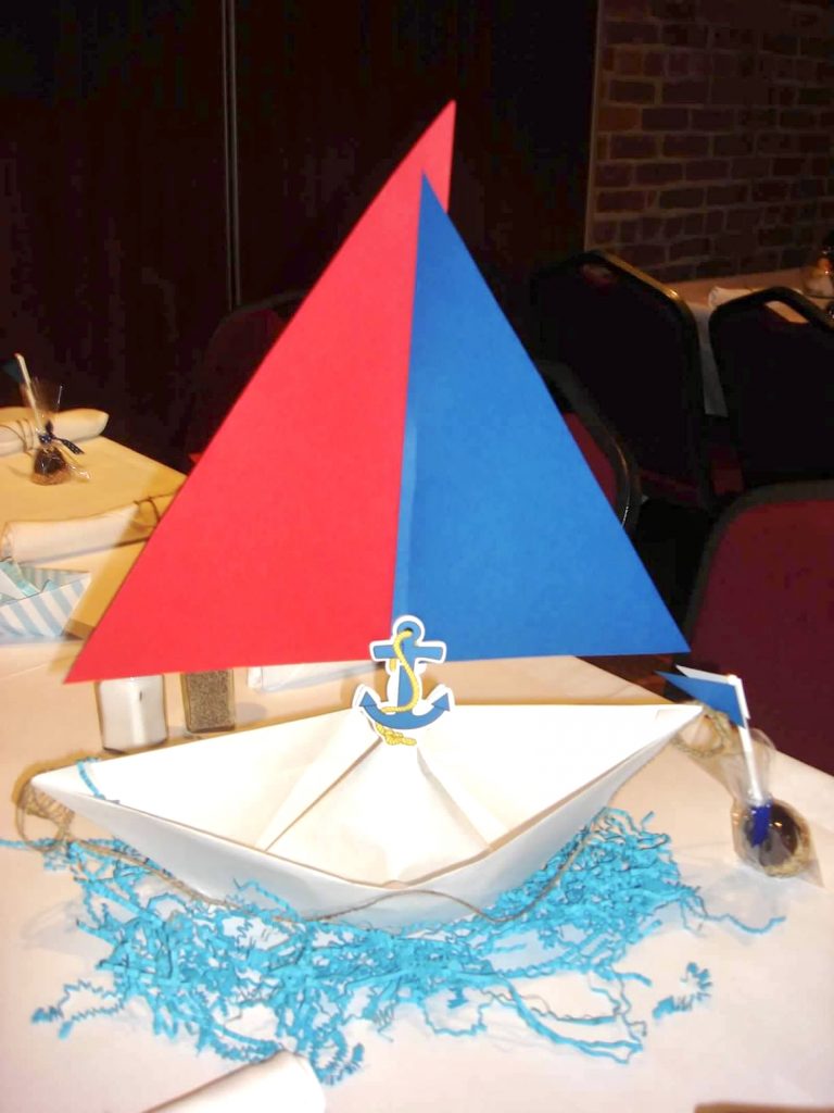 blue and red paper boat